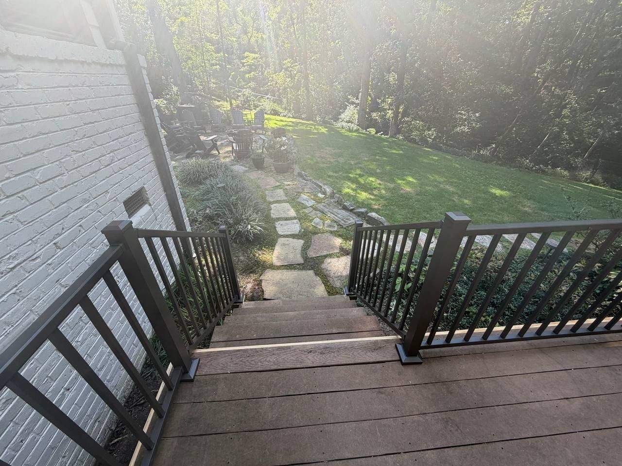 Elevated deck with black aluminum railing and stairs, rebuilt on new pressure-treated framing, Chattanooga TN